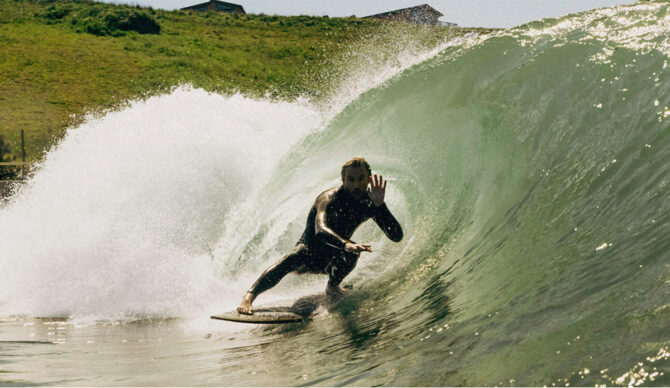 Lost Shore Surf Resort with a surfer