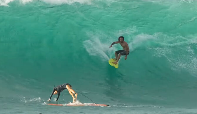 Mason Ho riding a small surfboard at Sunset Beach