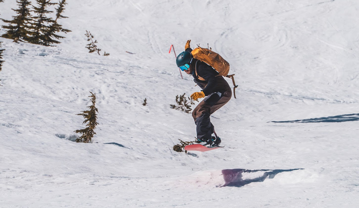 man jumping on snowboard