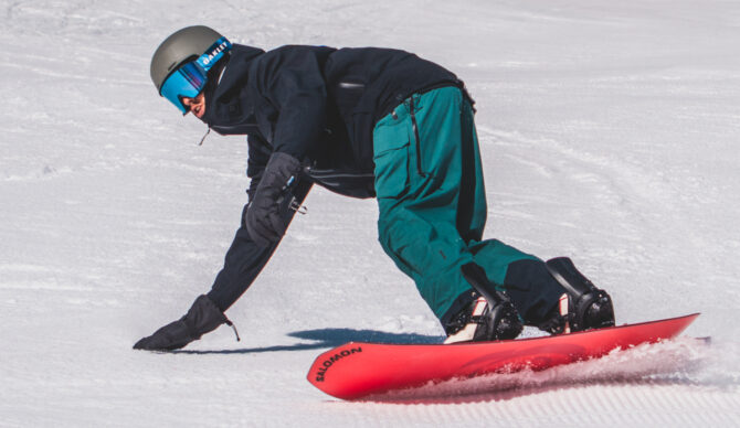 Salomon board with oakley goggles and trew gear bibs