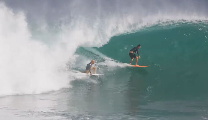 Kelly Slater surfing Uluwatu with a friend