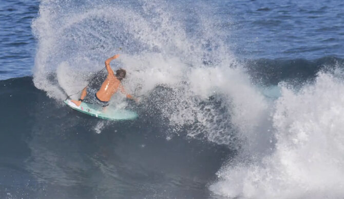 Clay Marzo doing a weird turn on a slab