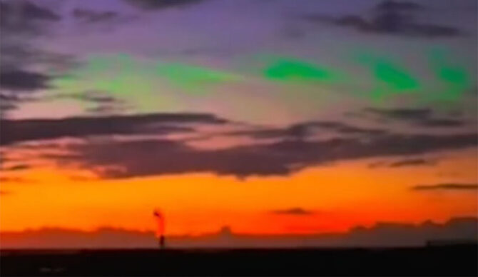 green lights in night sky over Kona, Hawaii