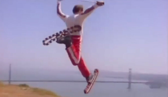 Man on rollerskis in front of the Golden Gate Bridge