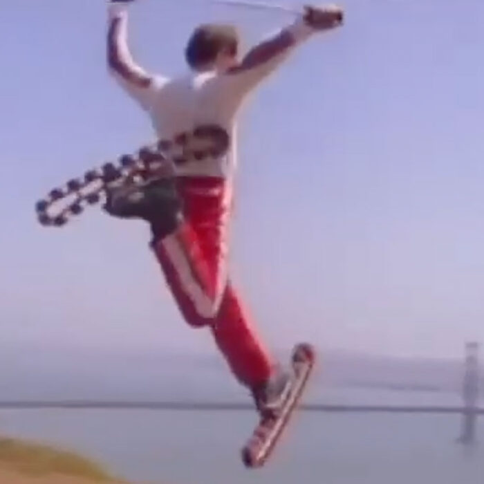 Man on rollerskis in front of the Golden Gate Bridge