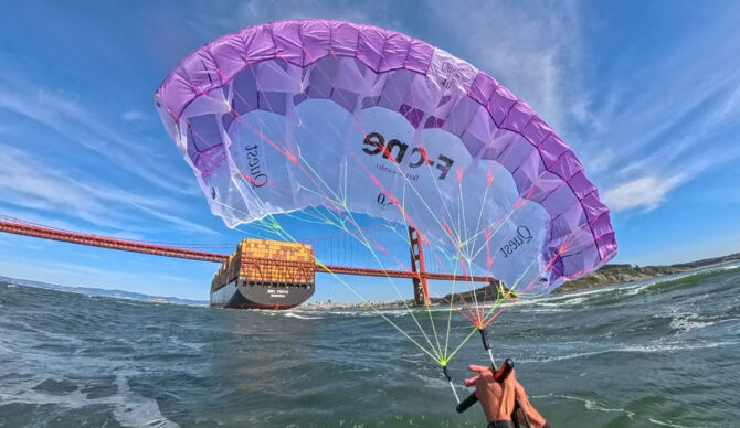 Quest parawing in the water with ggb and cargo ship in the background