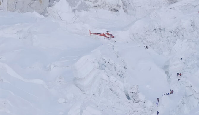 Climbers aboard a helicoper on Mt. Everest