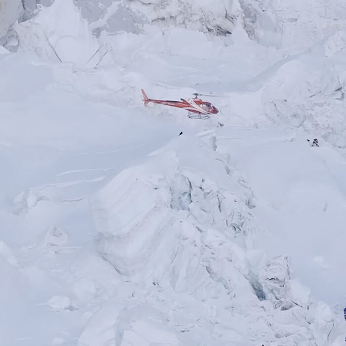 Climbers aboard a helicoper on Mt. Everest