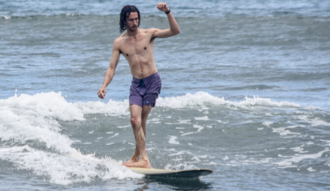 surfing in the Outerknown Apex Trunks