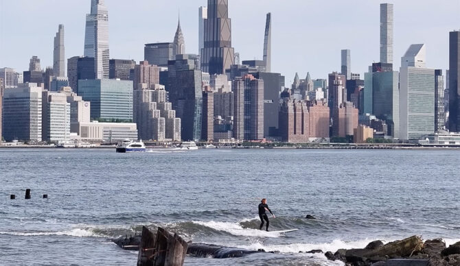 Ben Gravy surfing a wave in New York