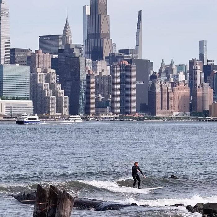 Ben Gravy surfing a wave in New York