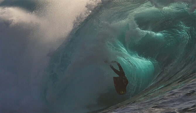 Shane Ackerman riding a bodyboard