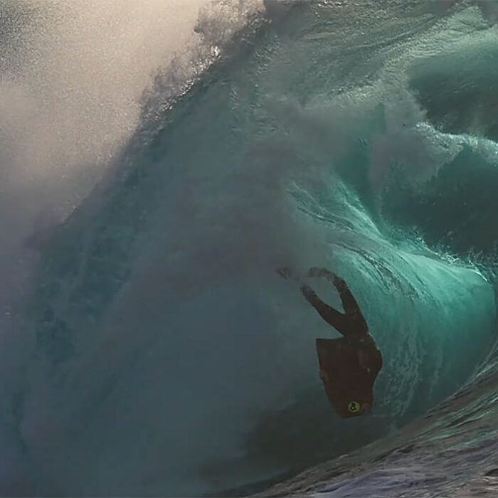 Shane Ackerman riding a bodyboard