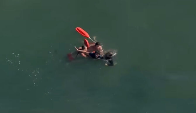 Los Angeles County Lifeguards with felon in ocean