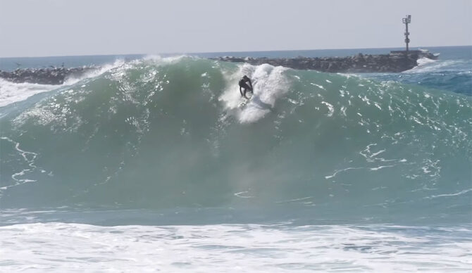 The Wedge with waves from Hurricane Genevieve