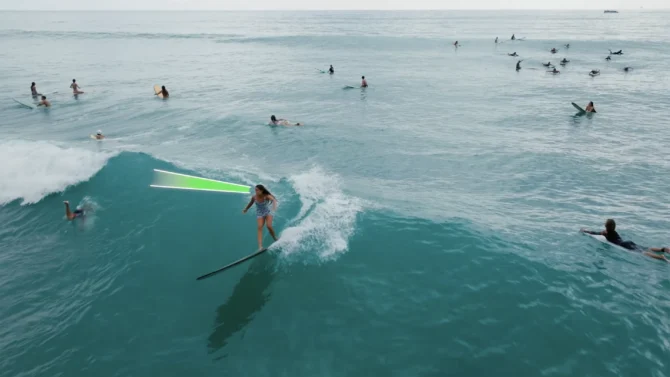 Bella Eberz on a longboard