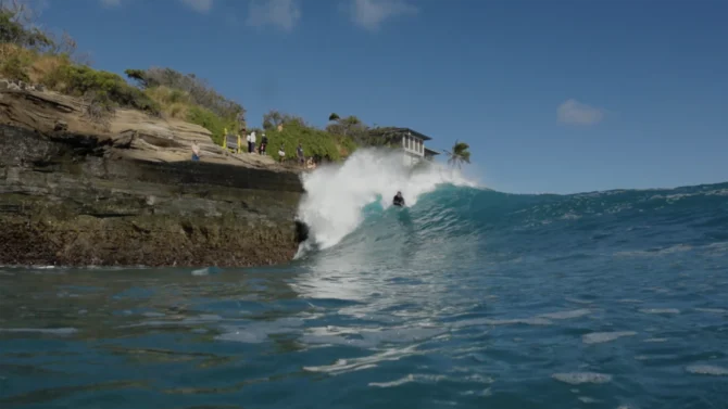 Kai Lenny surfing a surf mat at China Walls